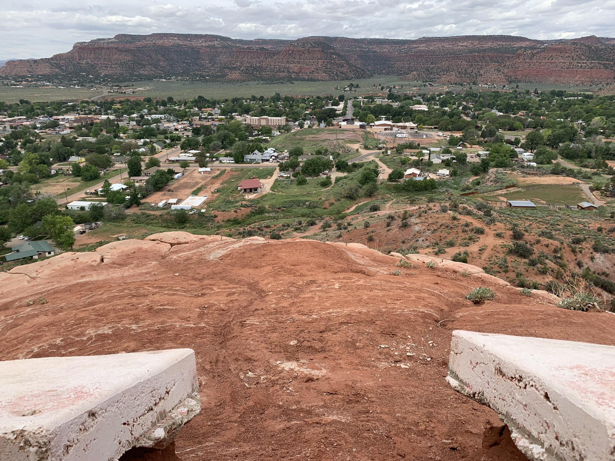 Panoramic view of a small town from a red rock mountain top.
