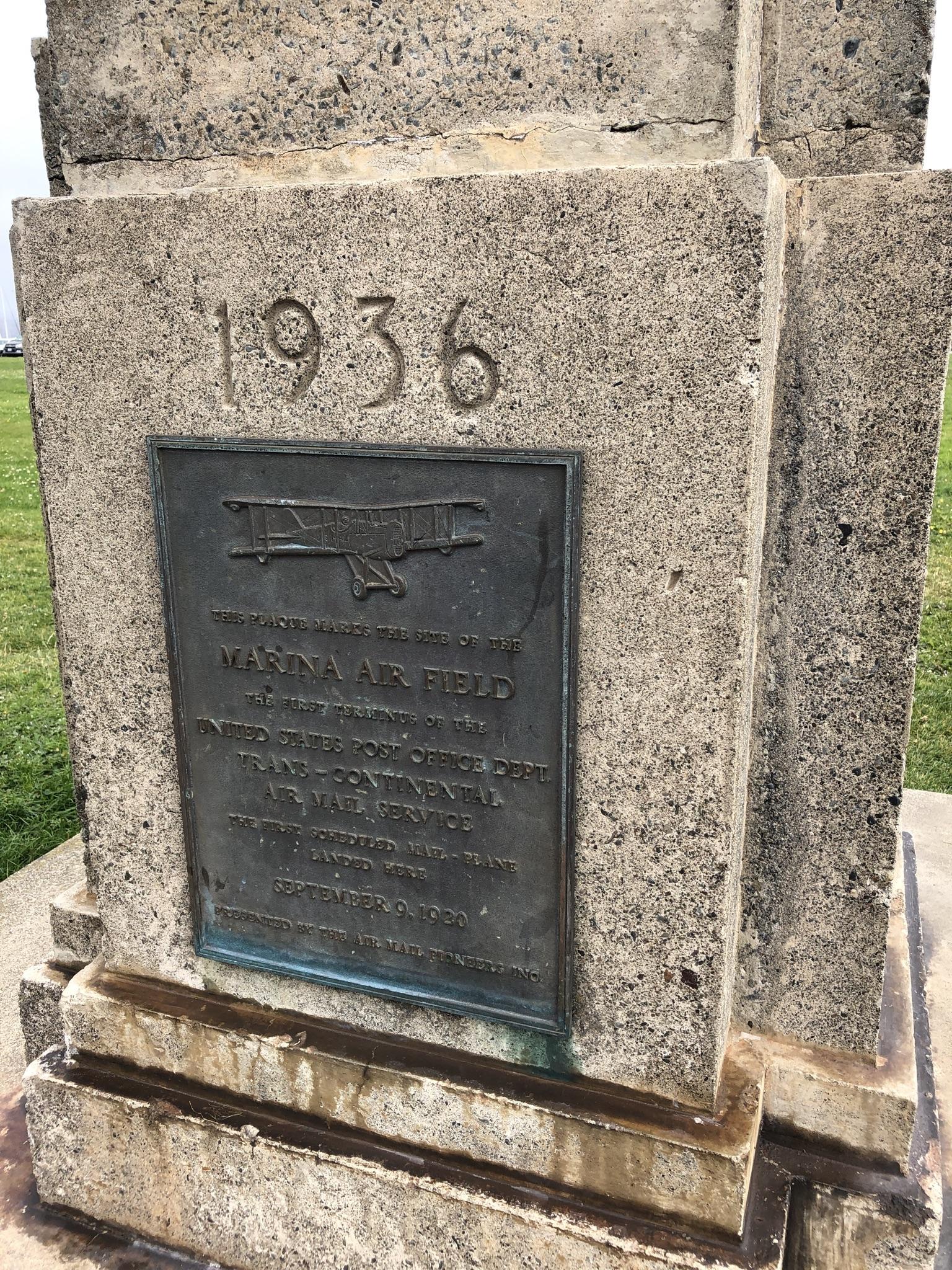 Concrete monument with a bronze plaque and '1936' inscription.