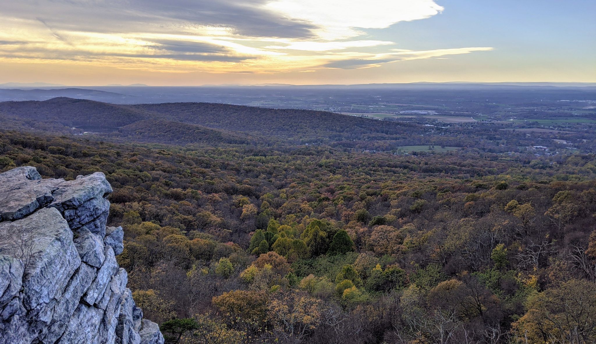 Panoramic view of a forested valley from a rocky outcrop at sunset. - Annapolis Rock via Appalachian Trail