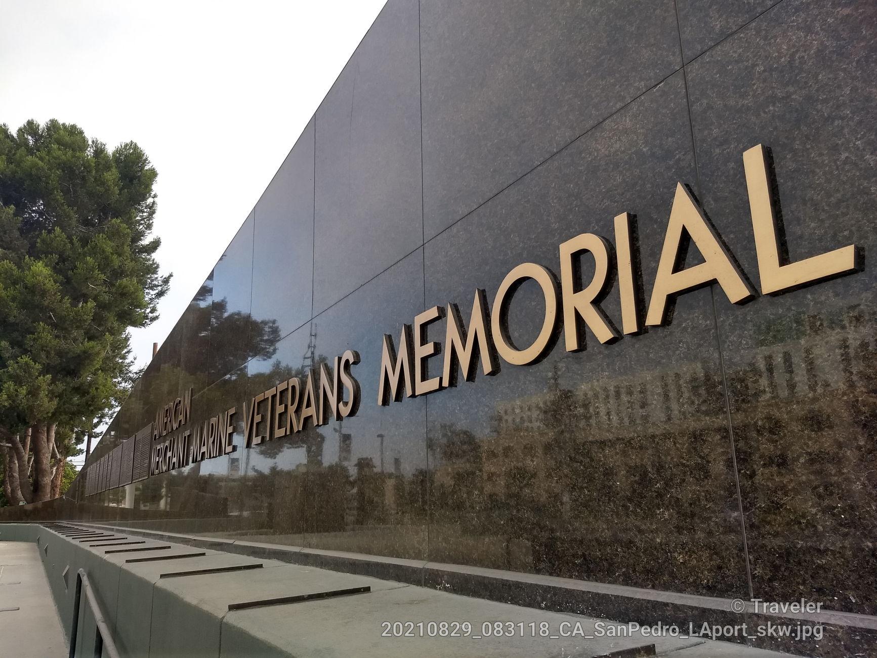 Large gold letters spelling "VETERANS MEMORIAL" on a dark wall.