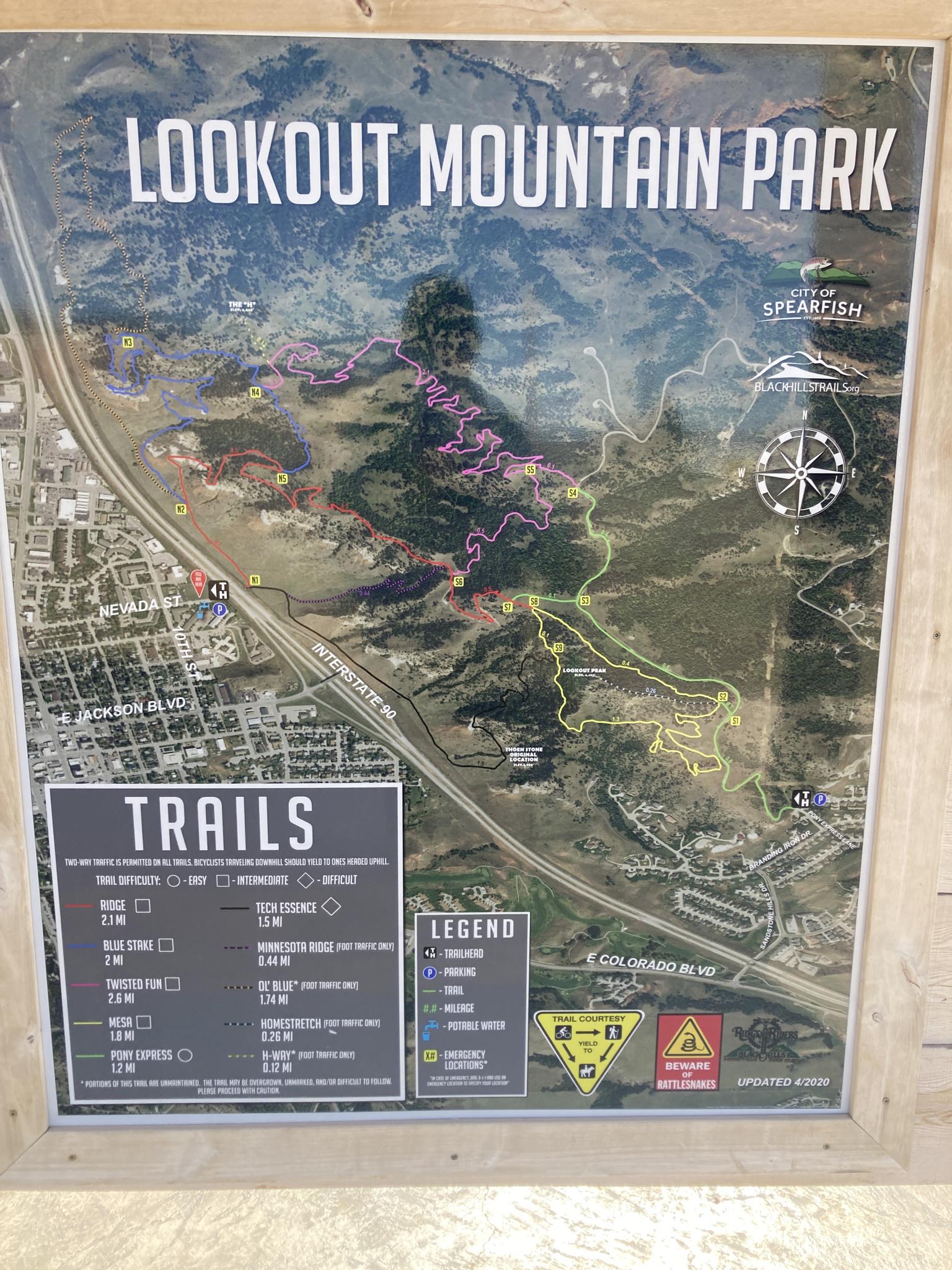 Close-up of a detailed trail map with various routes and a legend.
