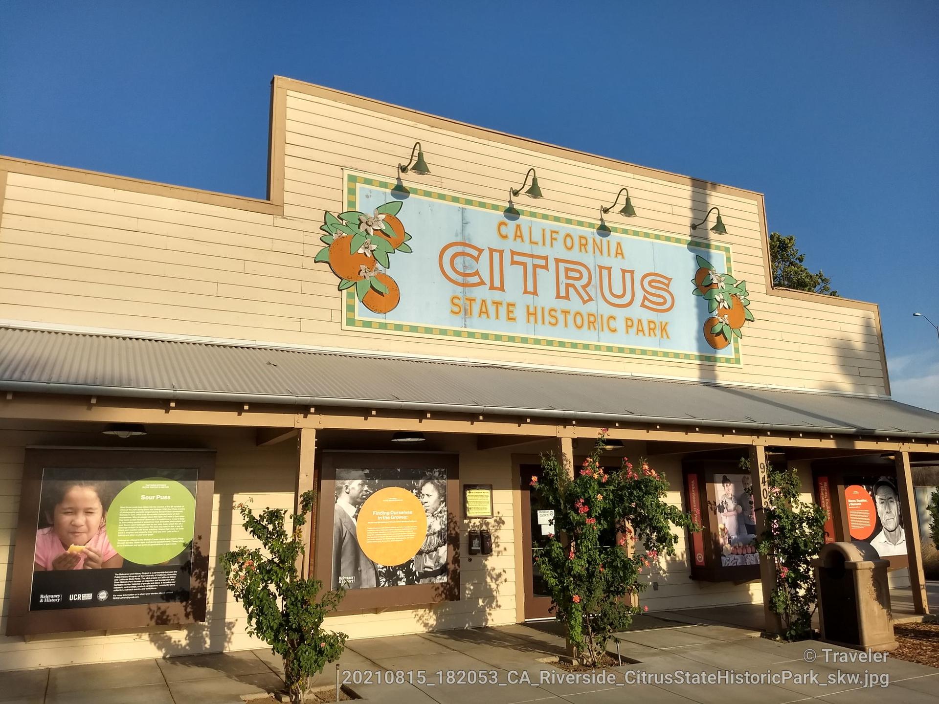Building with a 'Citrus' sign, display windows, and outdoor lighting.