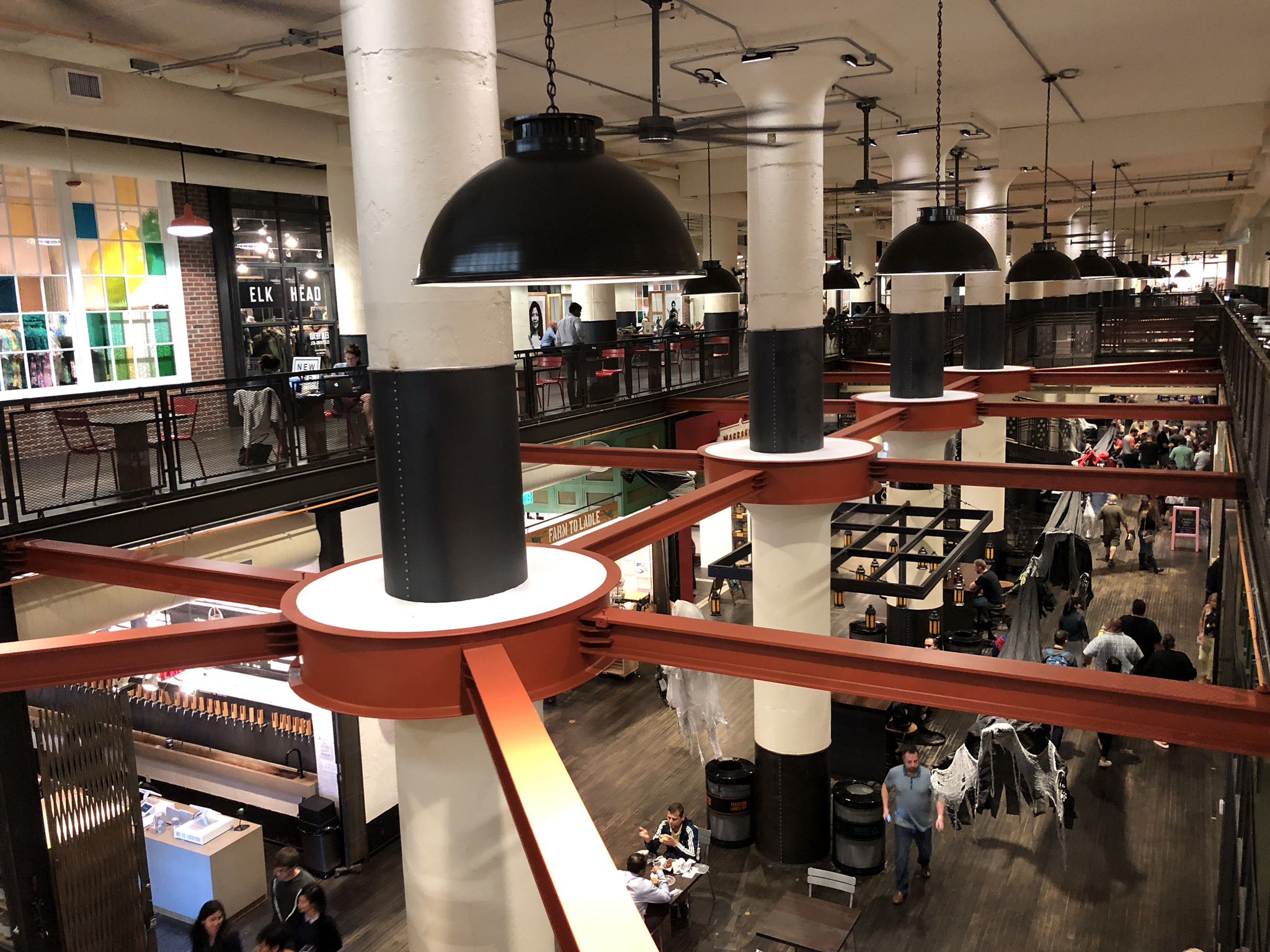 Busy multi-level indoor market with people dining and walking under large lights. - Atlanta BeltLine – Ponce City Market loop from Zoo Atlanta