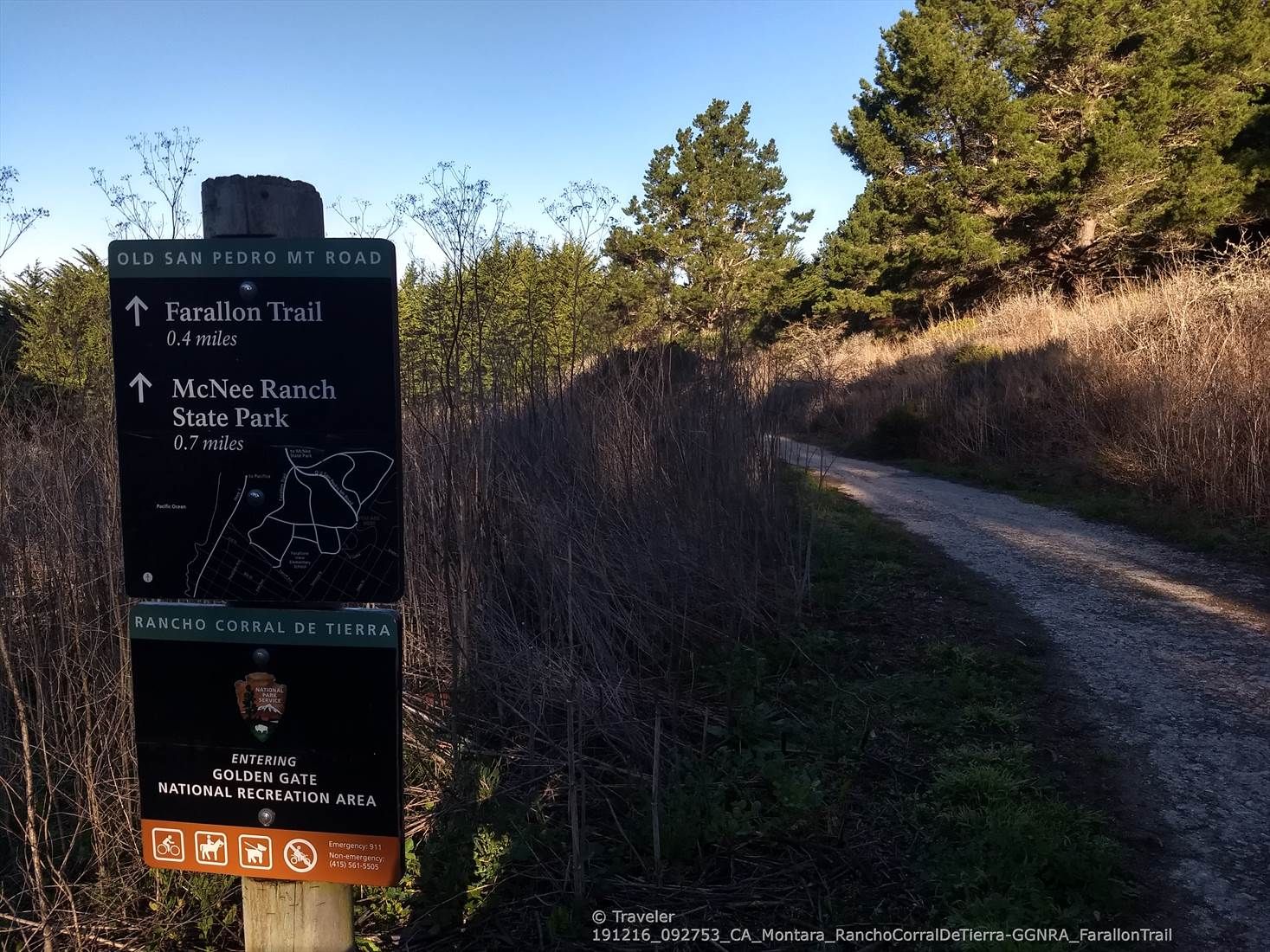 Trail sign with directions next to a dirt path, surrounded by dry brush. - Farallone Road and Old San Pedro Mountain Road Loop