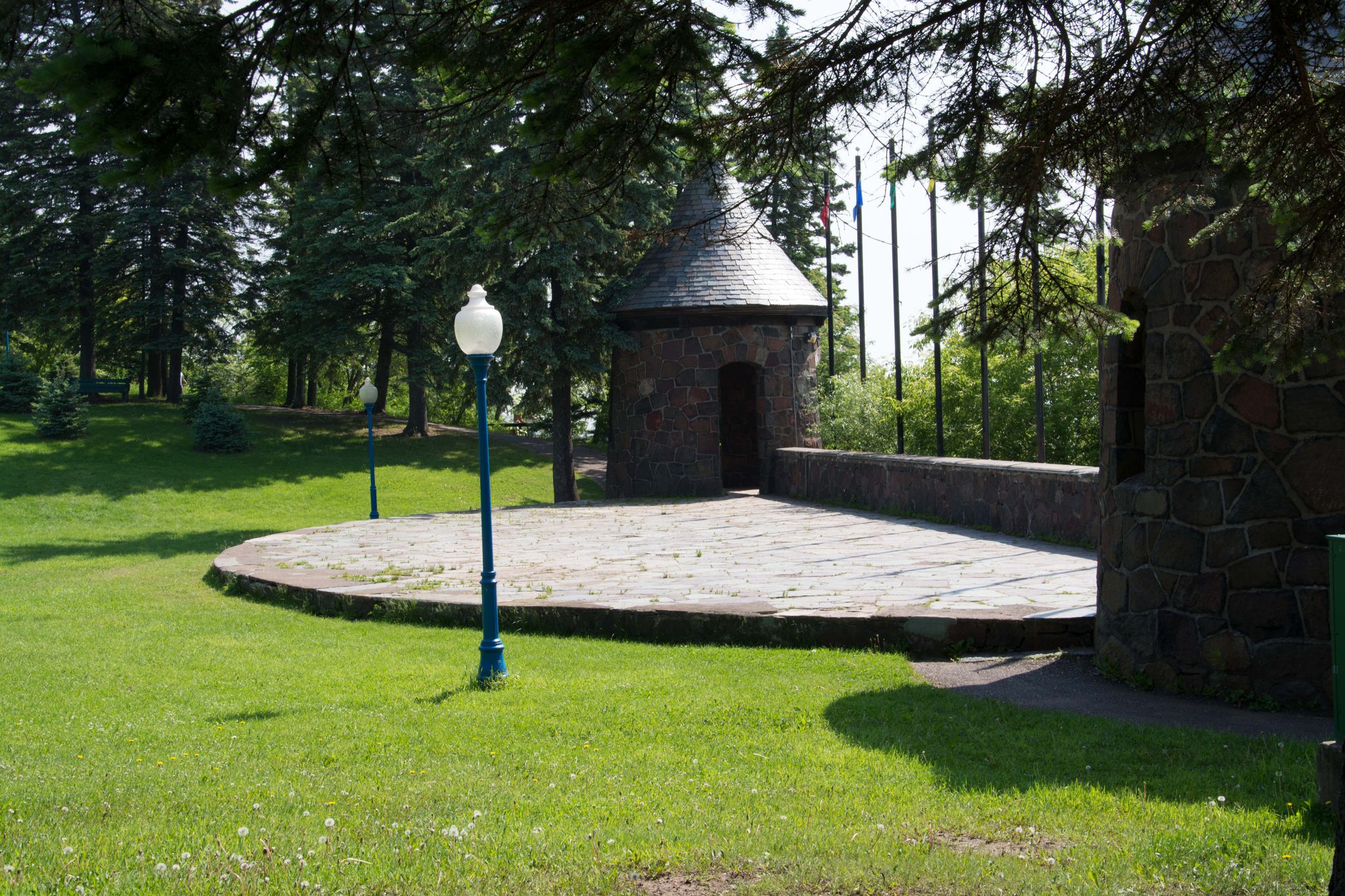 Stone turrets and a paved circular area in a sunny park. - Leif Erikson Park – Lakewalk loop from Duluth