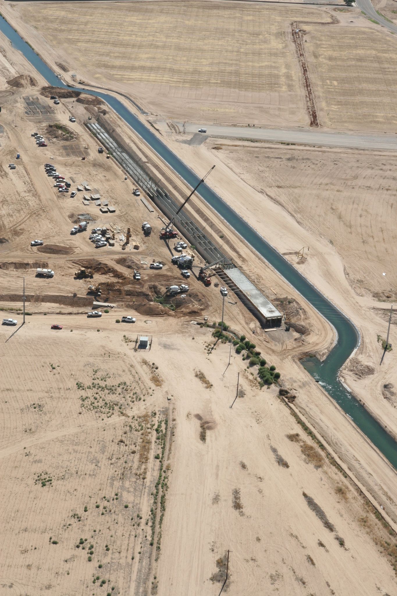 Aerial view of a long construction trench and canal in dry, flat terrain. - Bullard Wash Park & Roosevelt Canal loop
