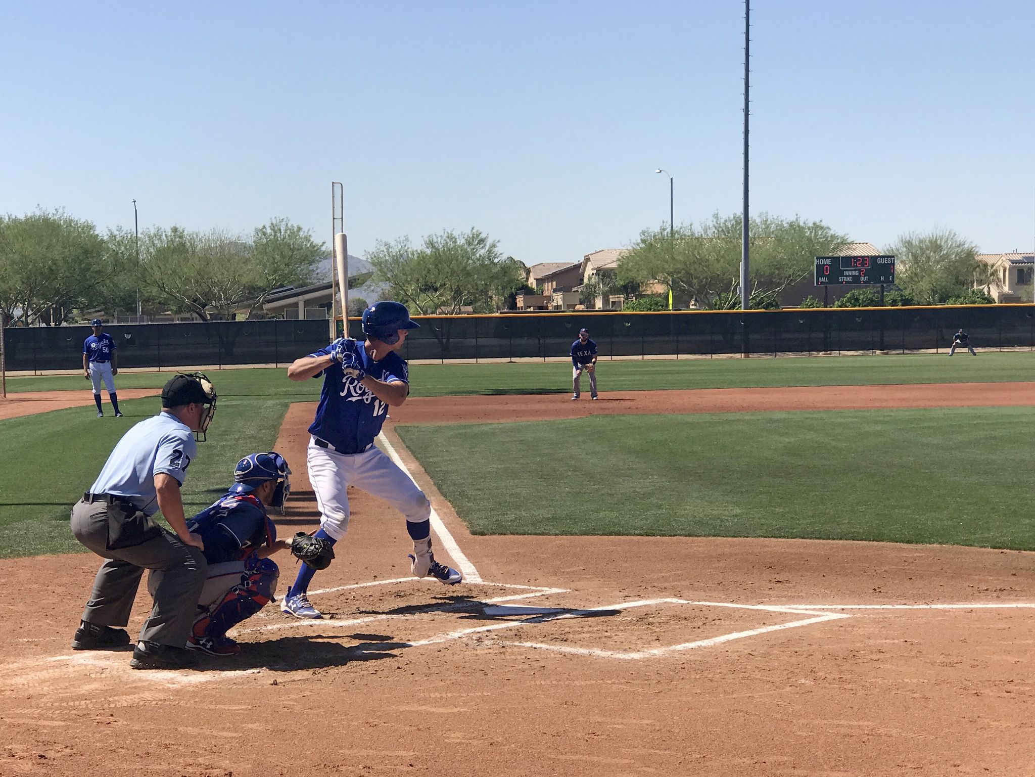 Baseball batter swings at a pitch during a sunny daytime game. - Surprise City loop