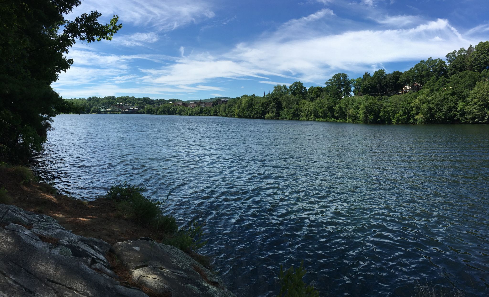 Sunny wide river with green forested banks and a bright blue sky. - Wantastiquet River Trailhead – Wantastiquet Trailhead loop from Brattleboro