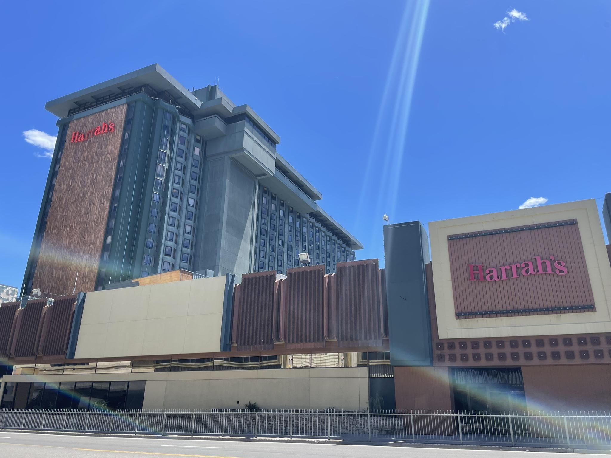 Tall hotel building with "Harrah's" sign under a bright blue sky. - South Lake Tahoe – Stateline-South Lake Tahoe loop from Harrah's Lake Tahoe