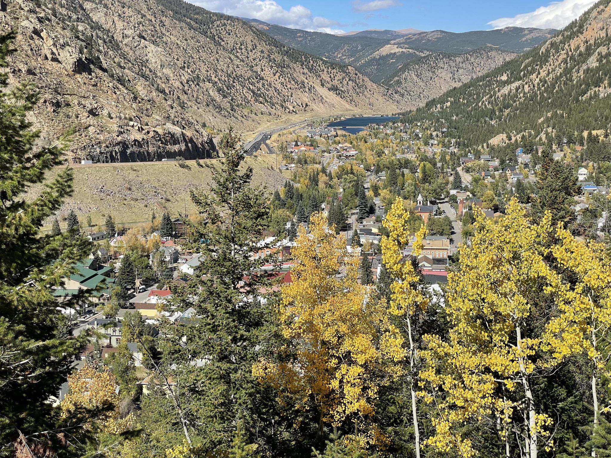 Scenic view of a town in a mountain valley with autumn trees and a lake. - Idaho Springs to Guanella Pass Summit