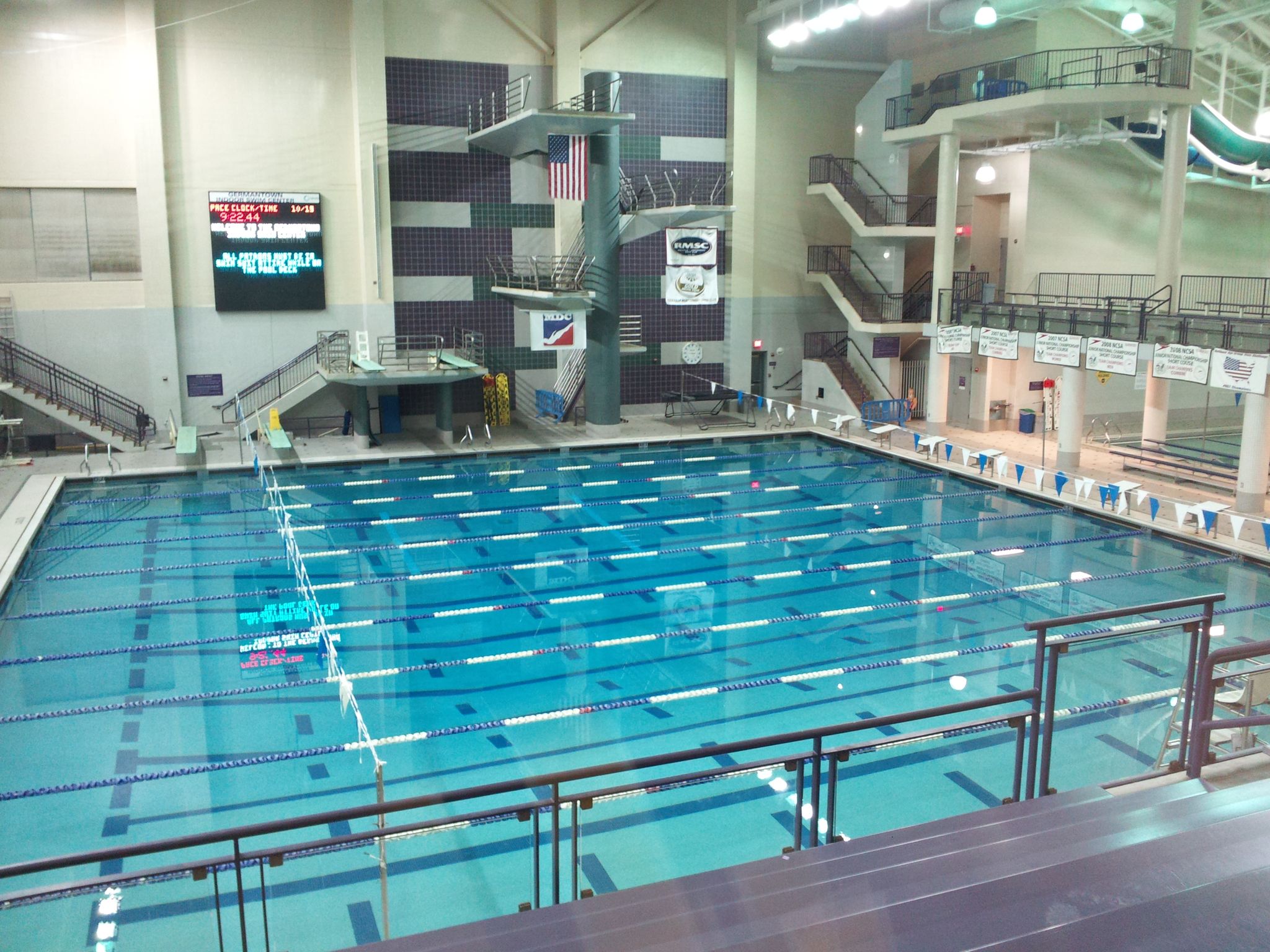 Large indoor swimming pool with multiple diving platforms under bright lights. - Schaeffer Farm Trail System loop from Boyds