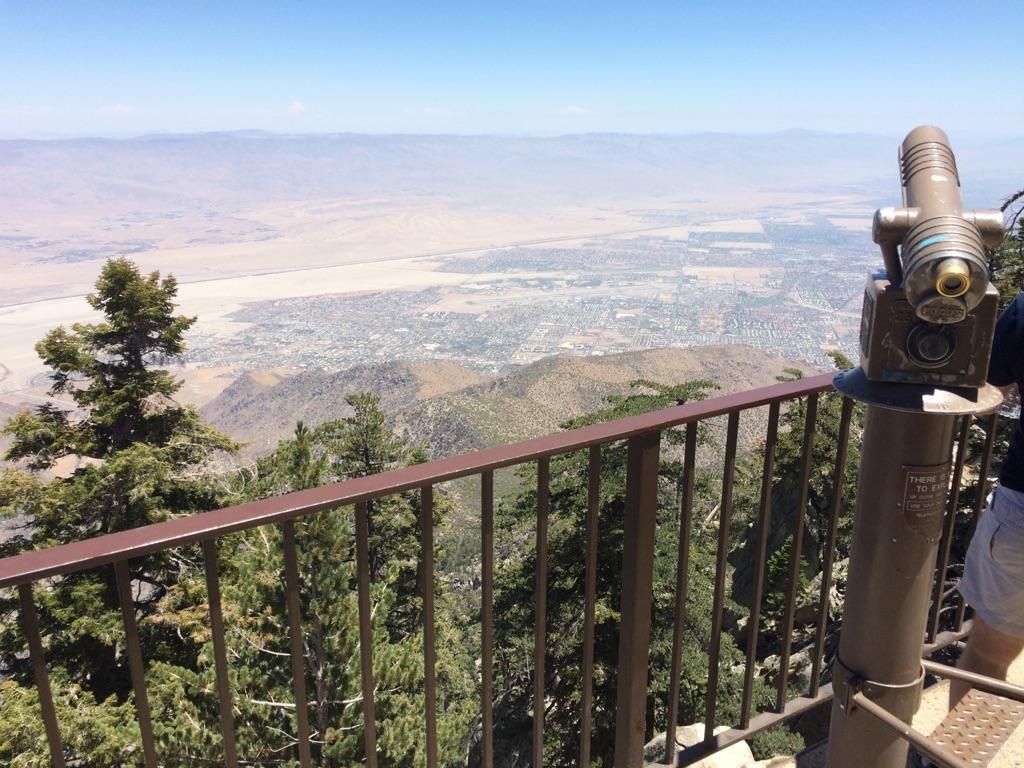 A coin-operated telescope overlooks a vast desert valley from a mountain. - San Jacinto Peak and Round Valley Loop
