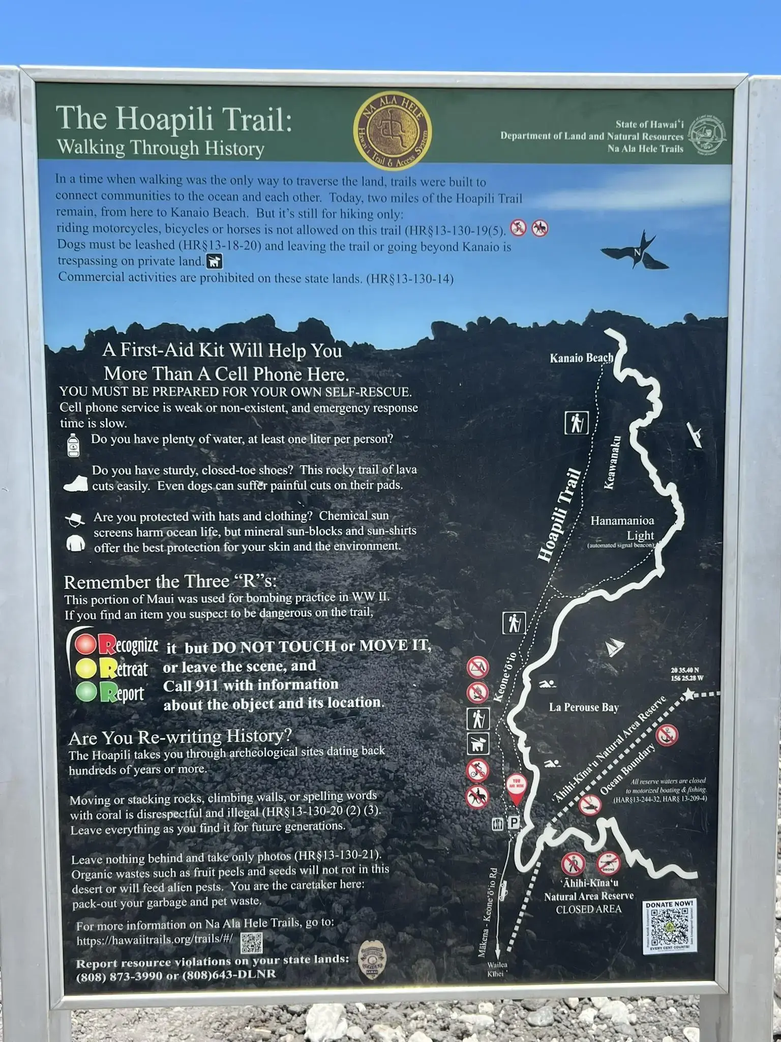 Informational sign with text and a map about a walking trail.