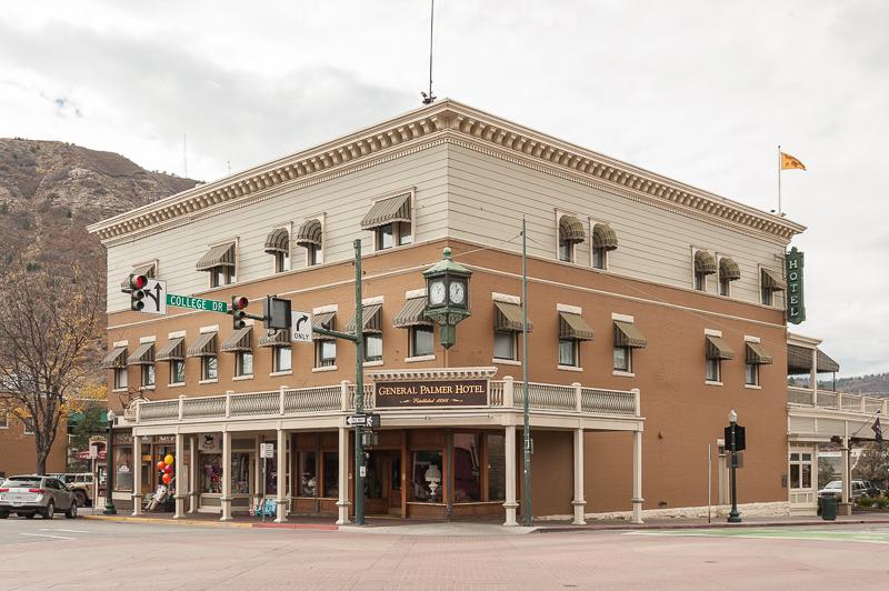 A large, historic-looking hotel building on a street corner under an overcast sky.