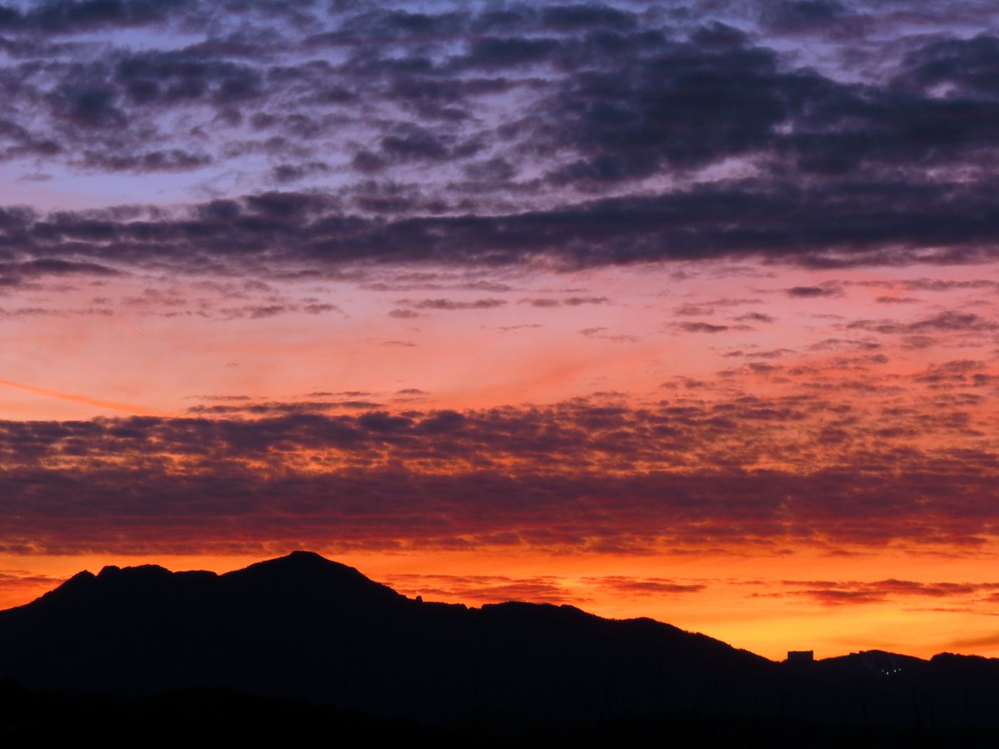 Dramatic mountain silhouette against a vibrant orange and purple sunset sky. - Goshen Branch access – Thunder Hill Overlook loop from Raven Rock Overlook
