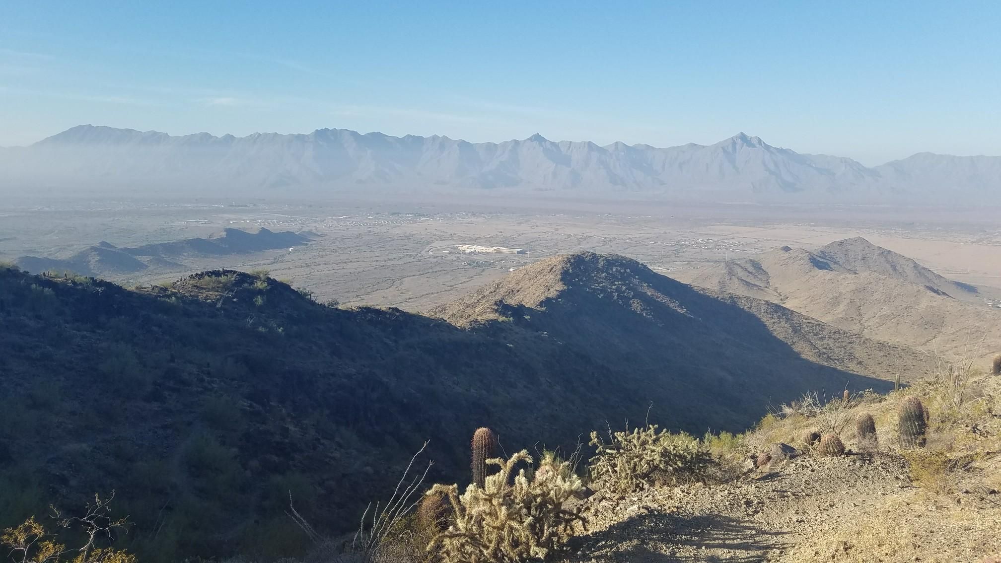 Vast desert valley with distant mountains under a clear blue sky. - Alta-Bajada Loop