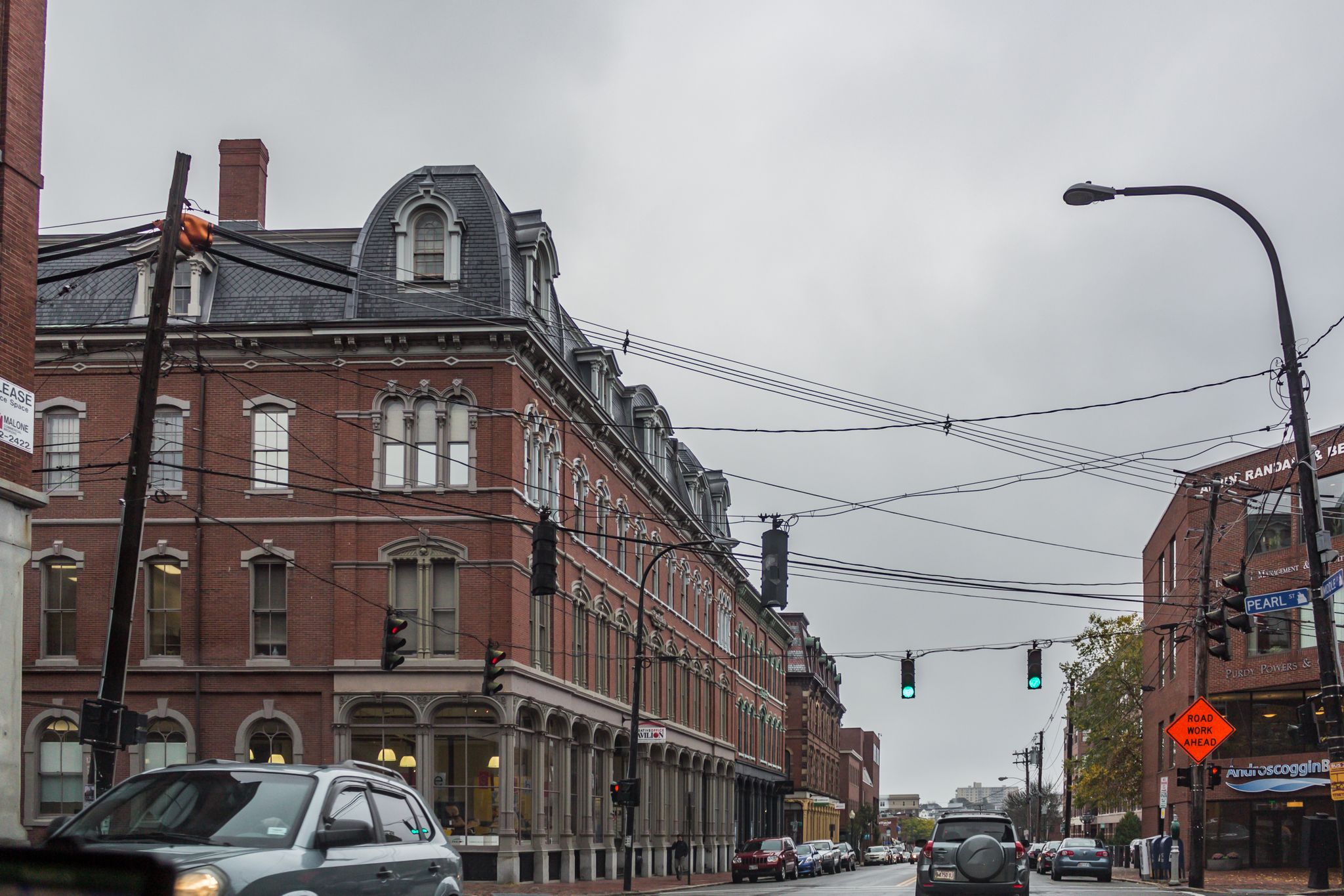Overcast day on a city street with old brick buildings and cars. - Poplar Ridge – Cumberland loop from North Yarmouth