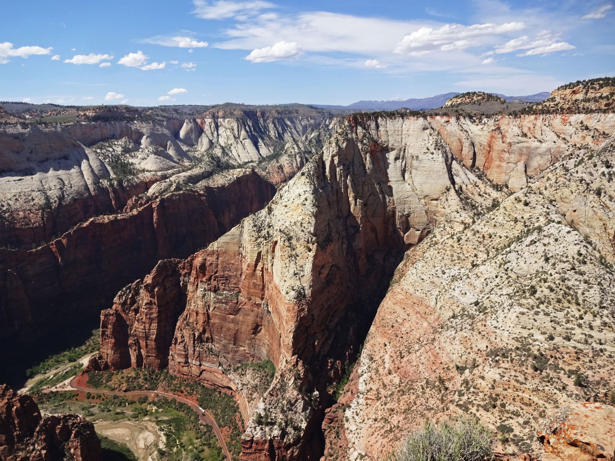 Deep, colorful canyon with a winding river below, under a bright blue sky. - Cable Mountain via Stave Spring Trailhead