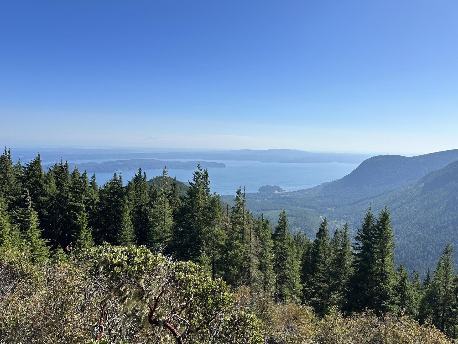 Panoramic view of a vast body of water and distant mountains.