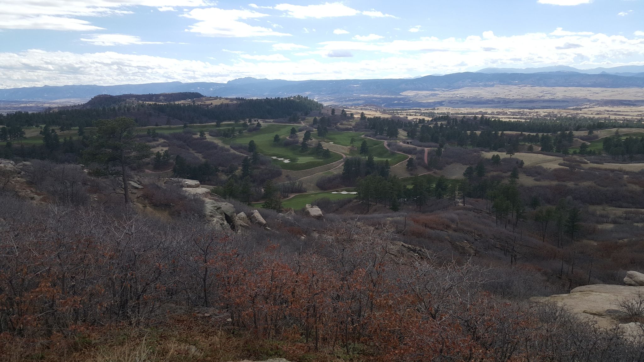 Panoramic view of a golf course winding through rocky hills under a cloudy sky. - Wildcat Point Overlook loop from Daniels Park