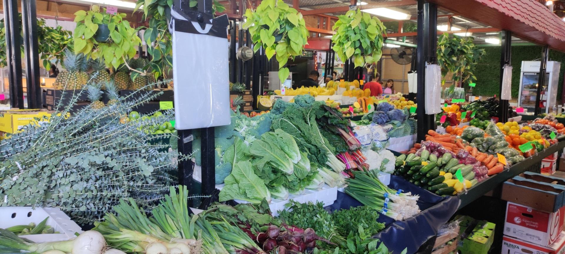 Colorful market stall displaying an abundance of fresh fruits and vegetables.