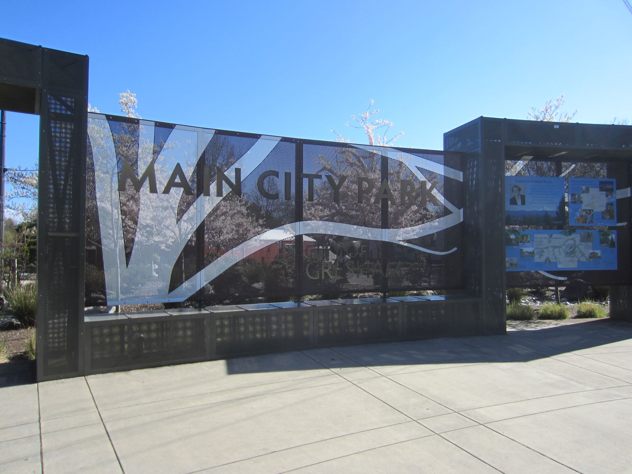 Large metal sign structure with 'MAIN CITY' text under a clear blue sky. - Springwater and Gresham-Fairview Trail Loop