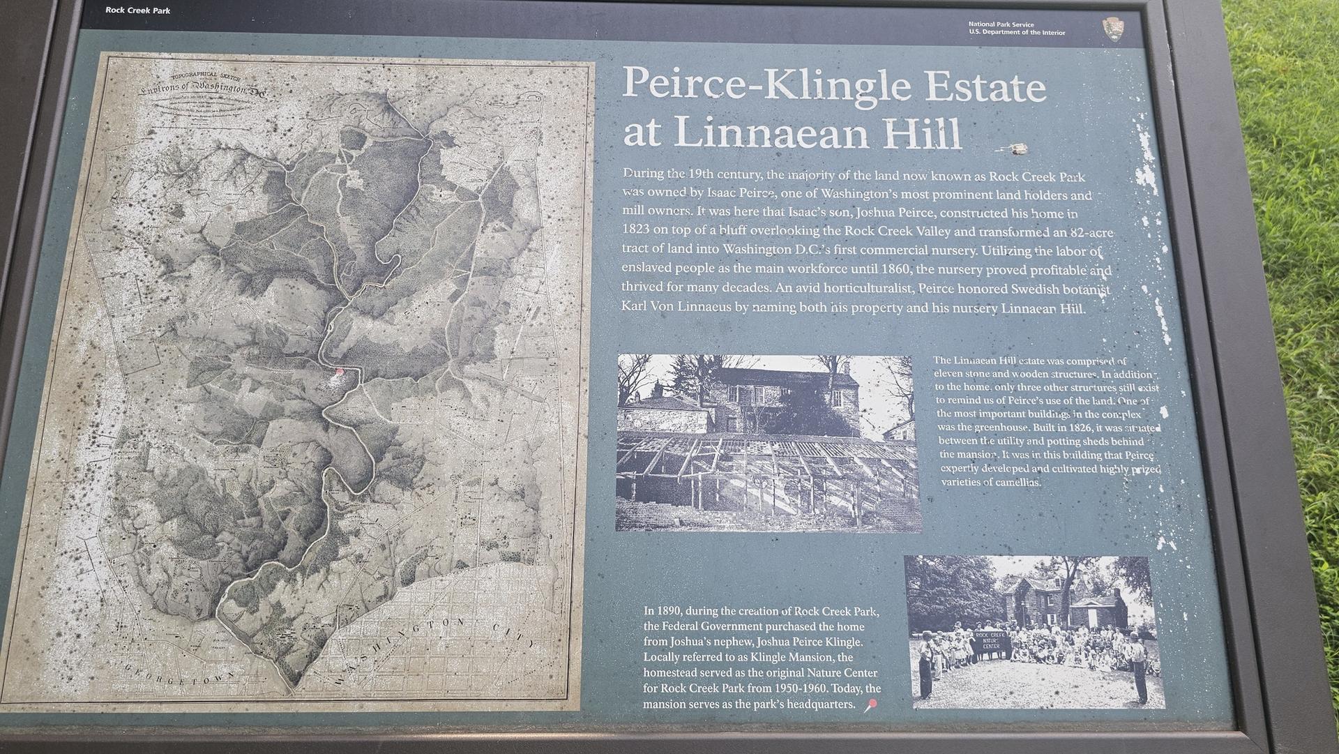 Outdoor informational sign with text and historical images on a sunny day.