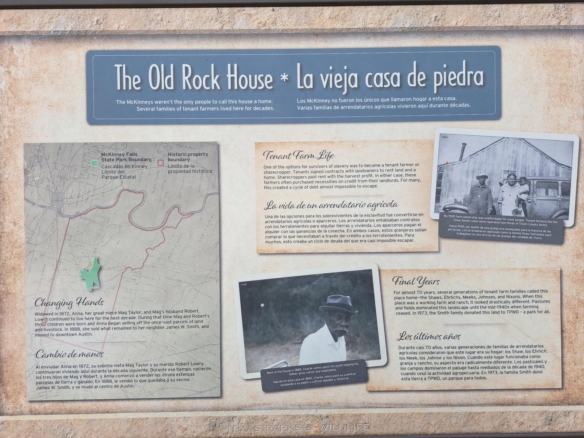 Informational sign with text, old photos, and a map about a rock house.