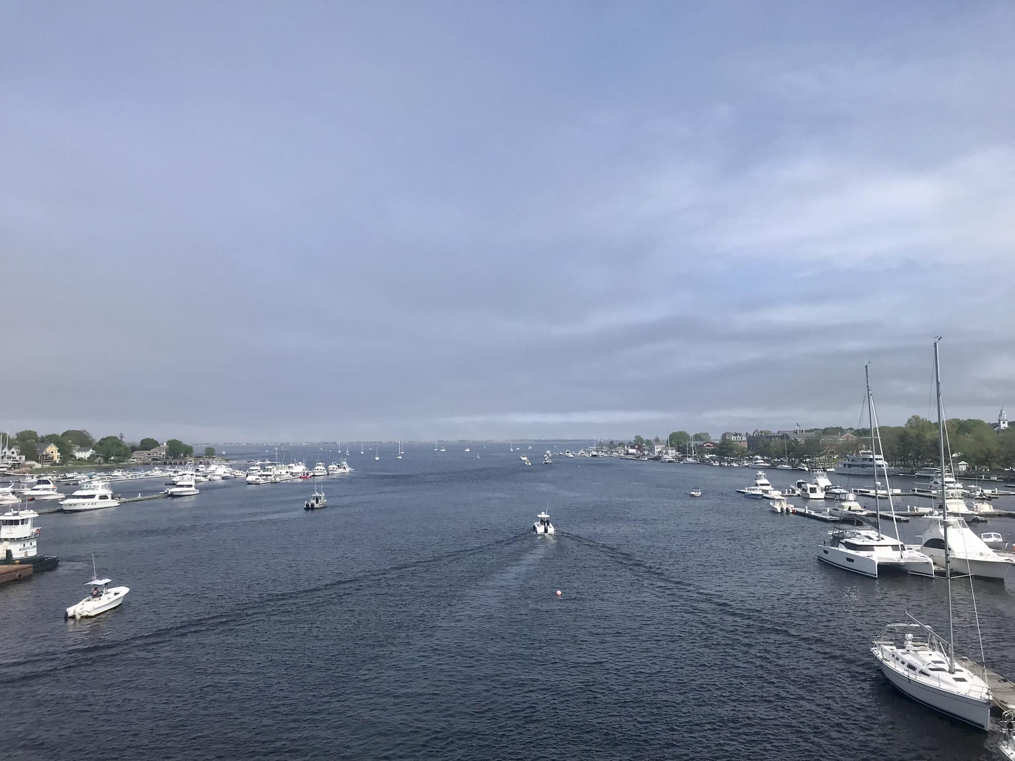 Wide river view with many boats and distant shores under an overcast sky. - Amesbury & East Coast Greenway loop from Newburyport