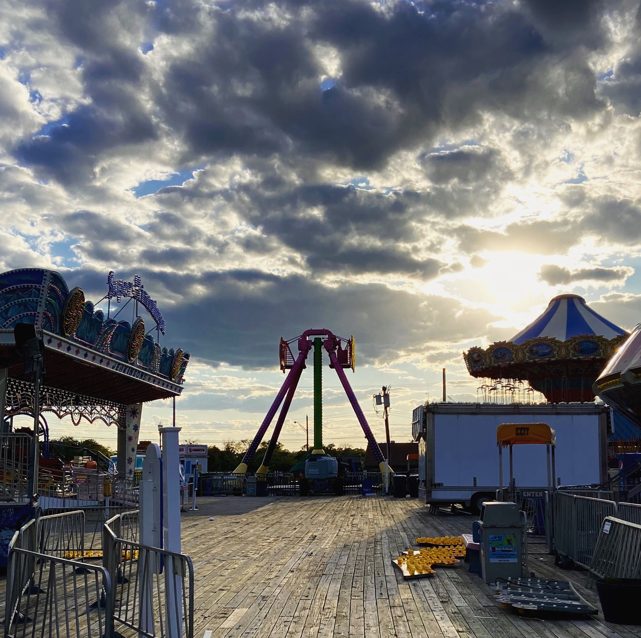 Amusement park rides on a boardwalk at sunset with dramatic clouds. - Point Pleasant Beach – Point Pleasant Beach loop from Point Pleasant Beach
