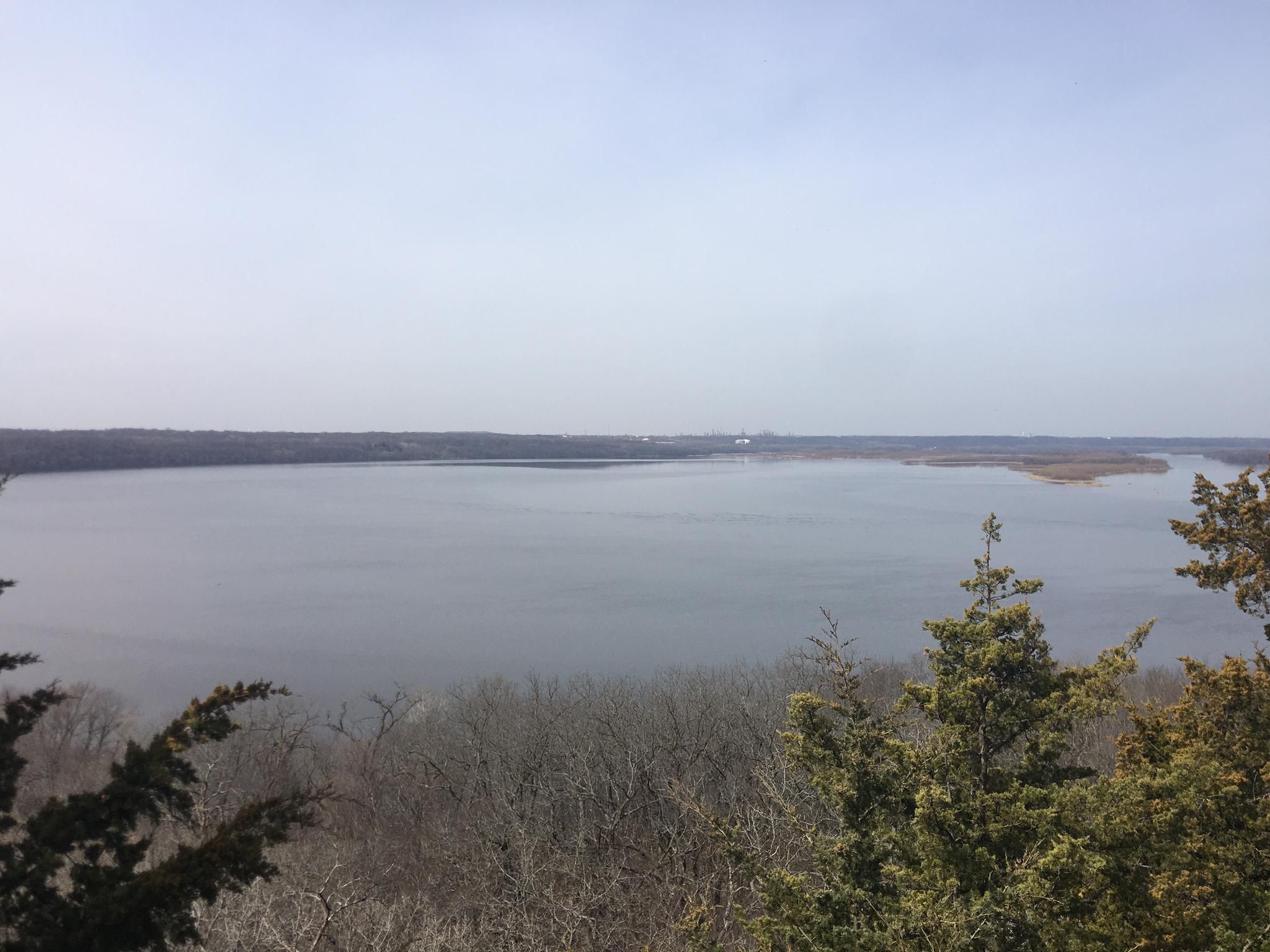 Wide view of a large body of water with distant forested shores. - Mississippi River Greenway Loop