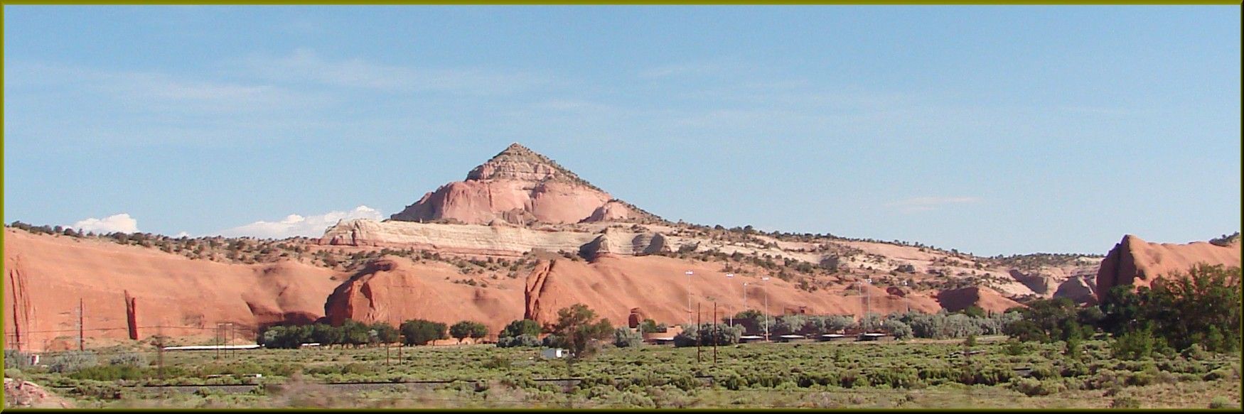 Panoramic view of vast red rock formations under a clear blue sky. - Pyramid Rock Trail