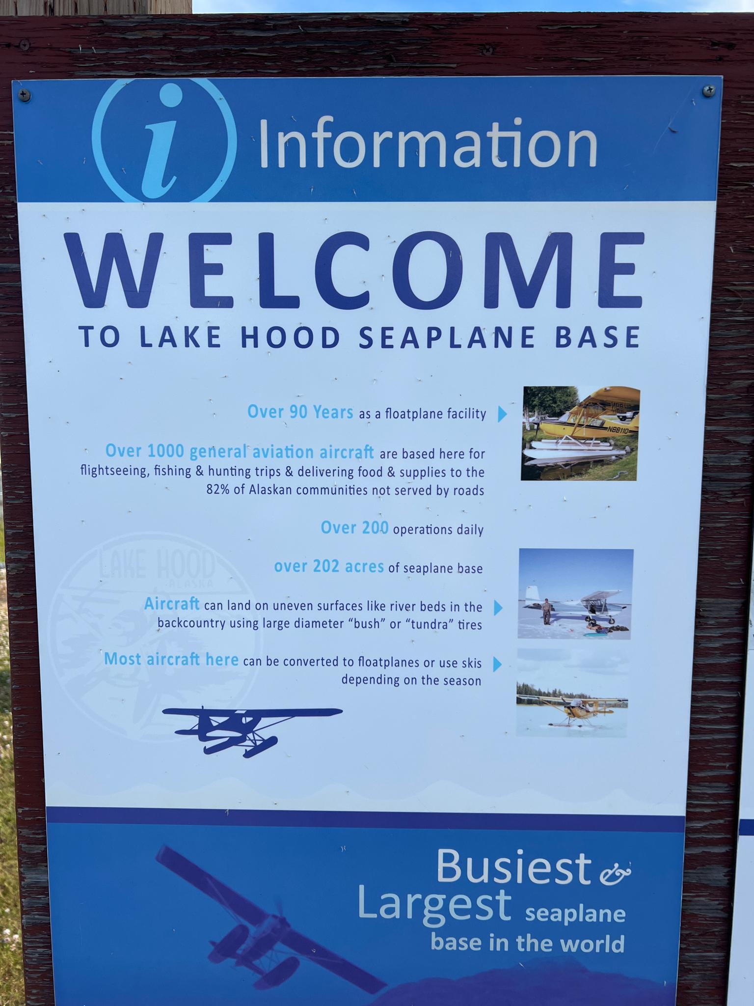 A blue and white information sign with text and small illustrative images.
