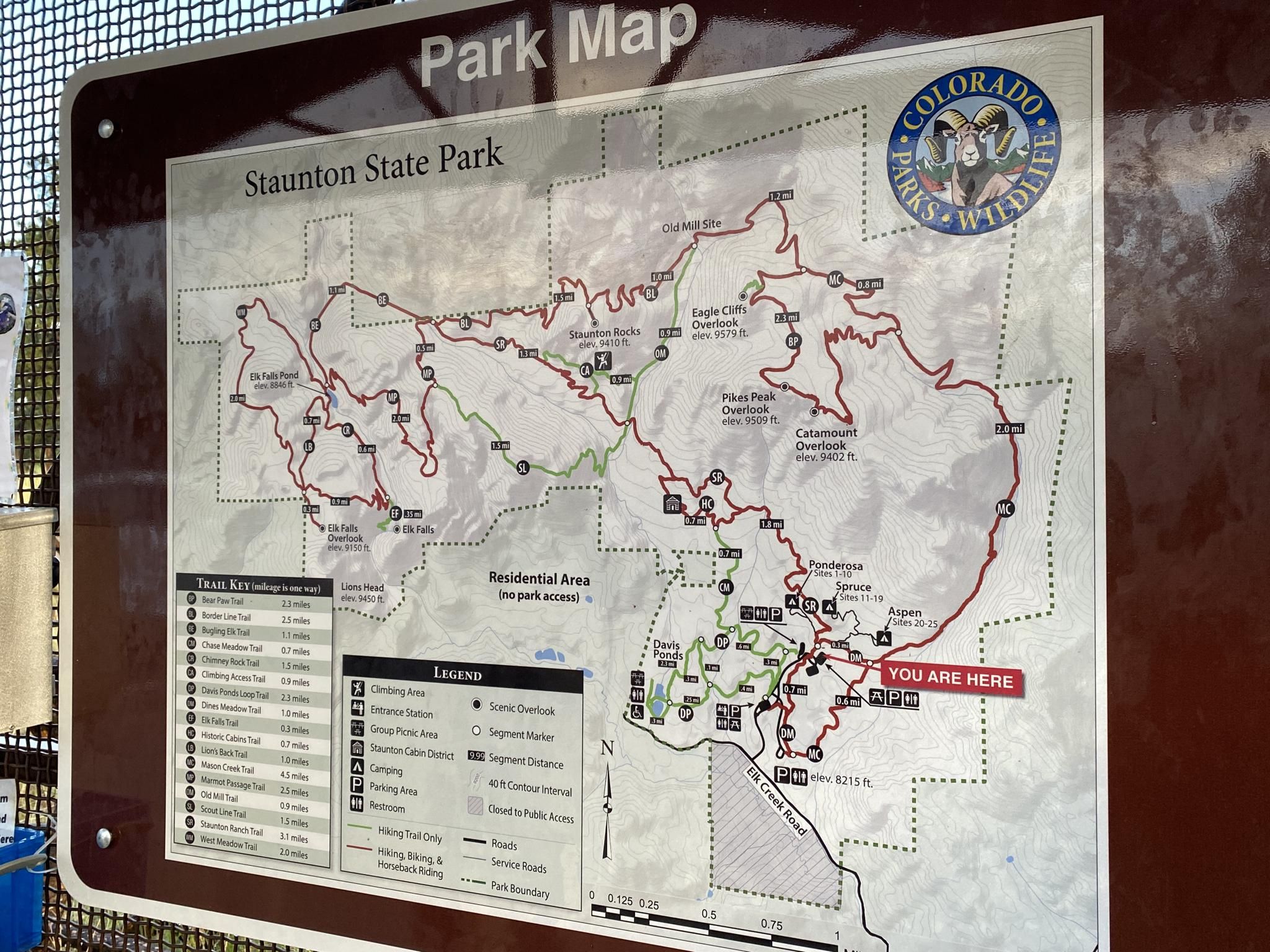 A detailed park map sign showing various trails and features. - Davis Ponds Loop Trail