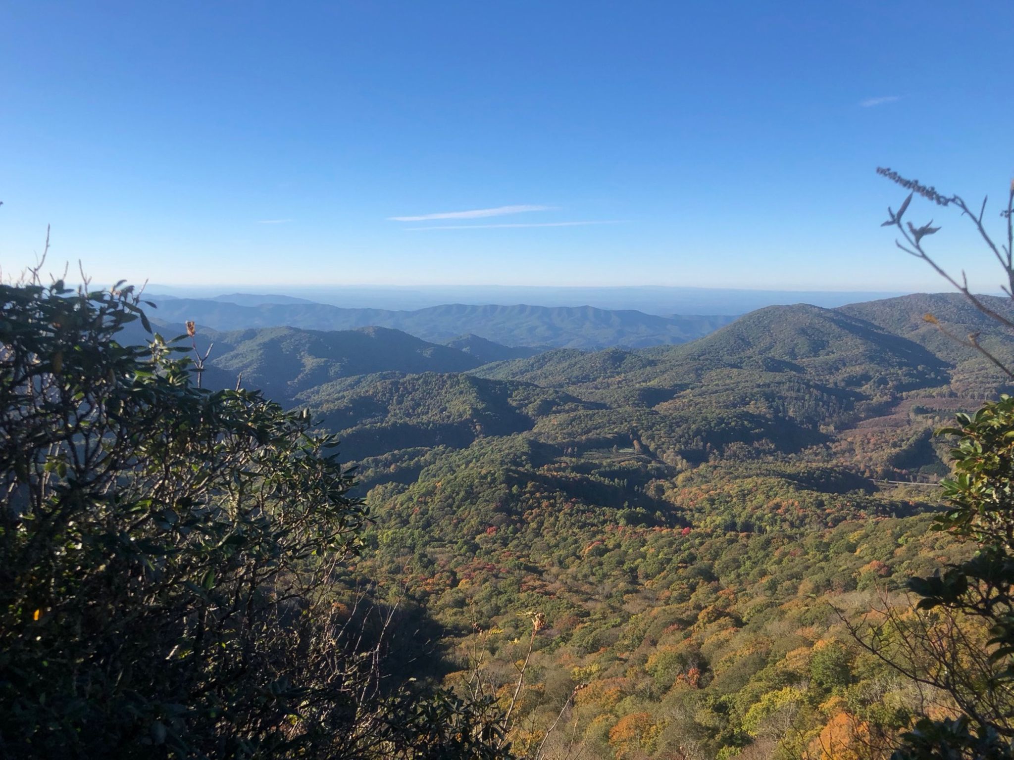 Vast mountain landscape with forested hills, autumn colors, and a clear blue sky. - Appalachian Trail: Iron Mountain Gap to Hughes Gap