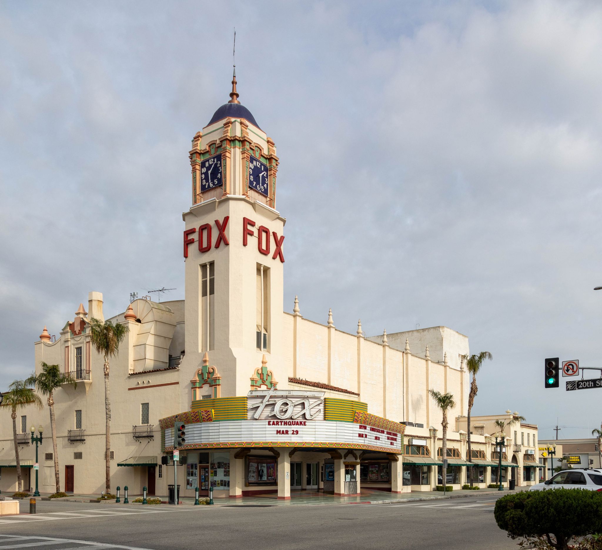 Historic theater building with a prominent clock tower on a city street. - Majestic Fox Theater loop from Los Hermanos Parking Lot