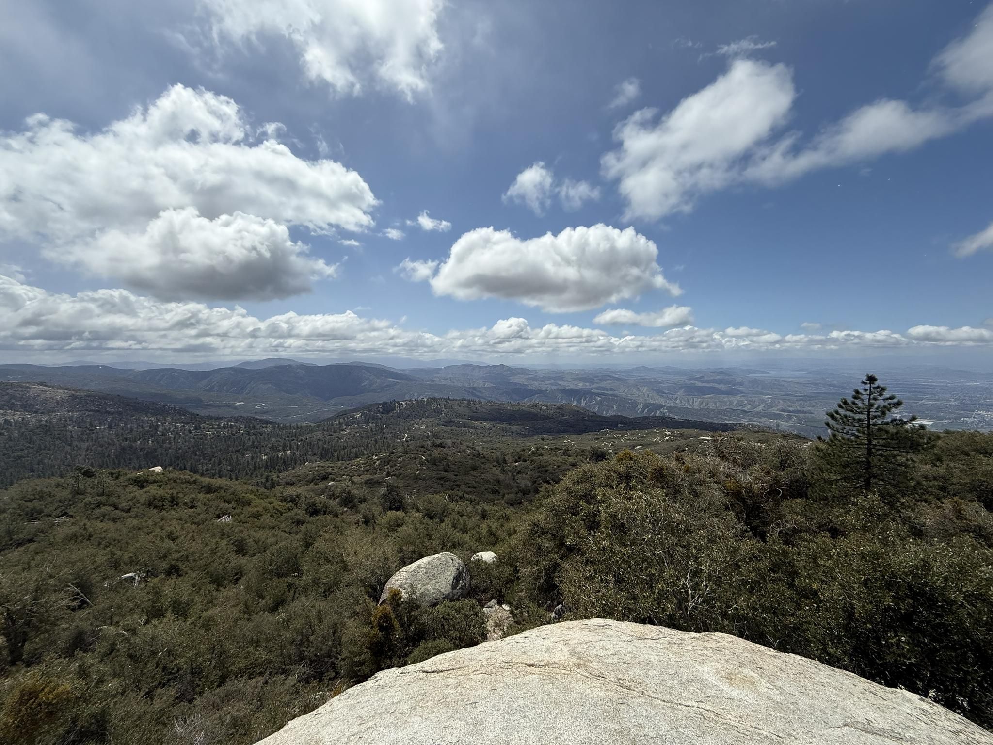 Expansive mountain vista under a bright, partly cloudy sky. - The Hub: Toptimator, Black Bear & Smokestack Loop