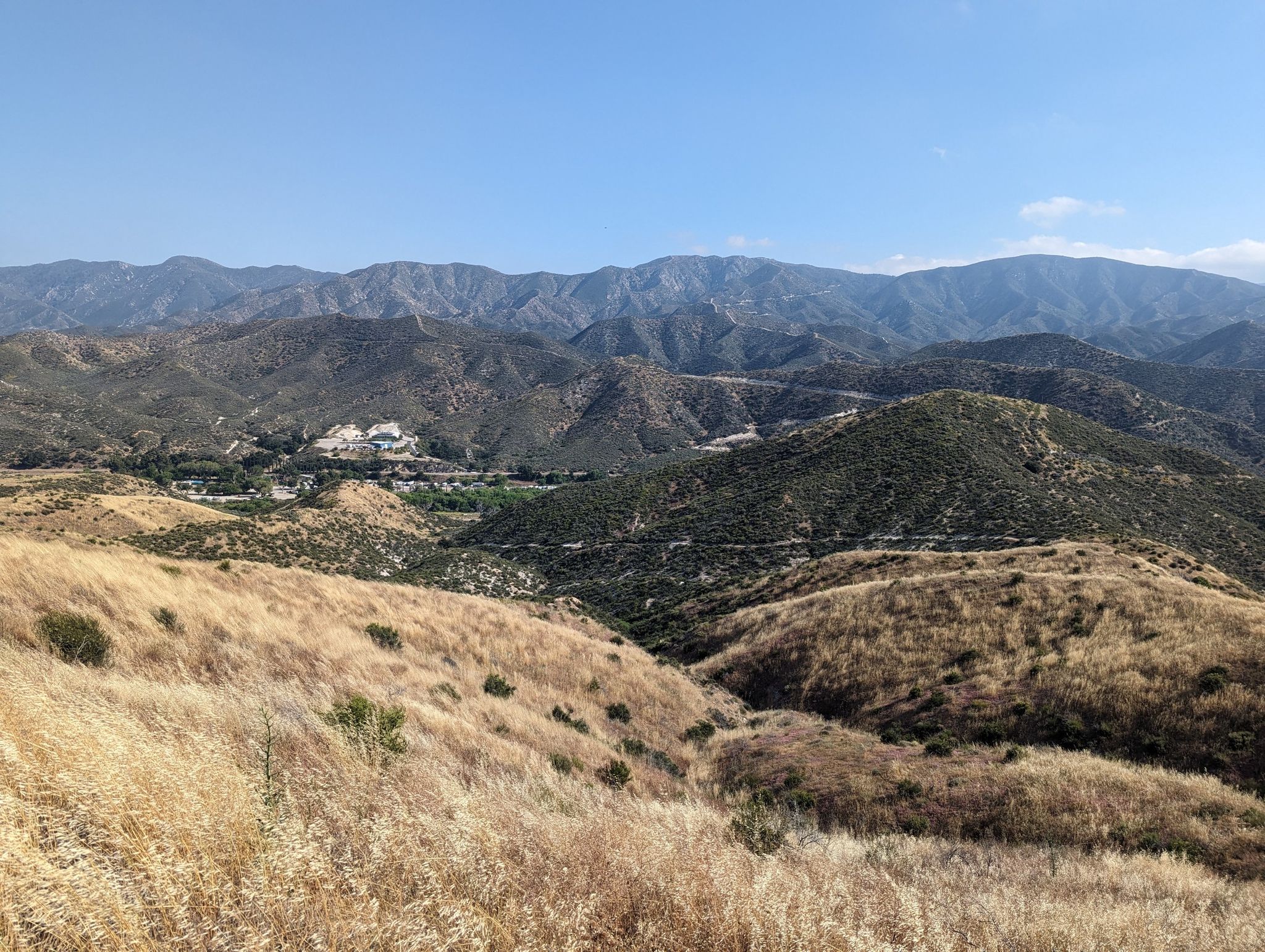 Vast dry hills and distant green valleys under a clear bright blue sky. - Pacific Crest Trail: Soledad Canyon to Indian Canyon