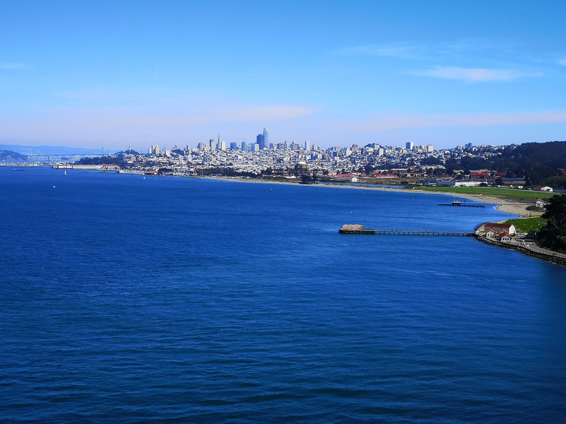 City skyline across a wide bay under a clear blue sky. - Bay Area Ridge Trail: Golden Gate Bridge