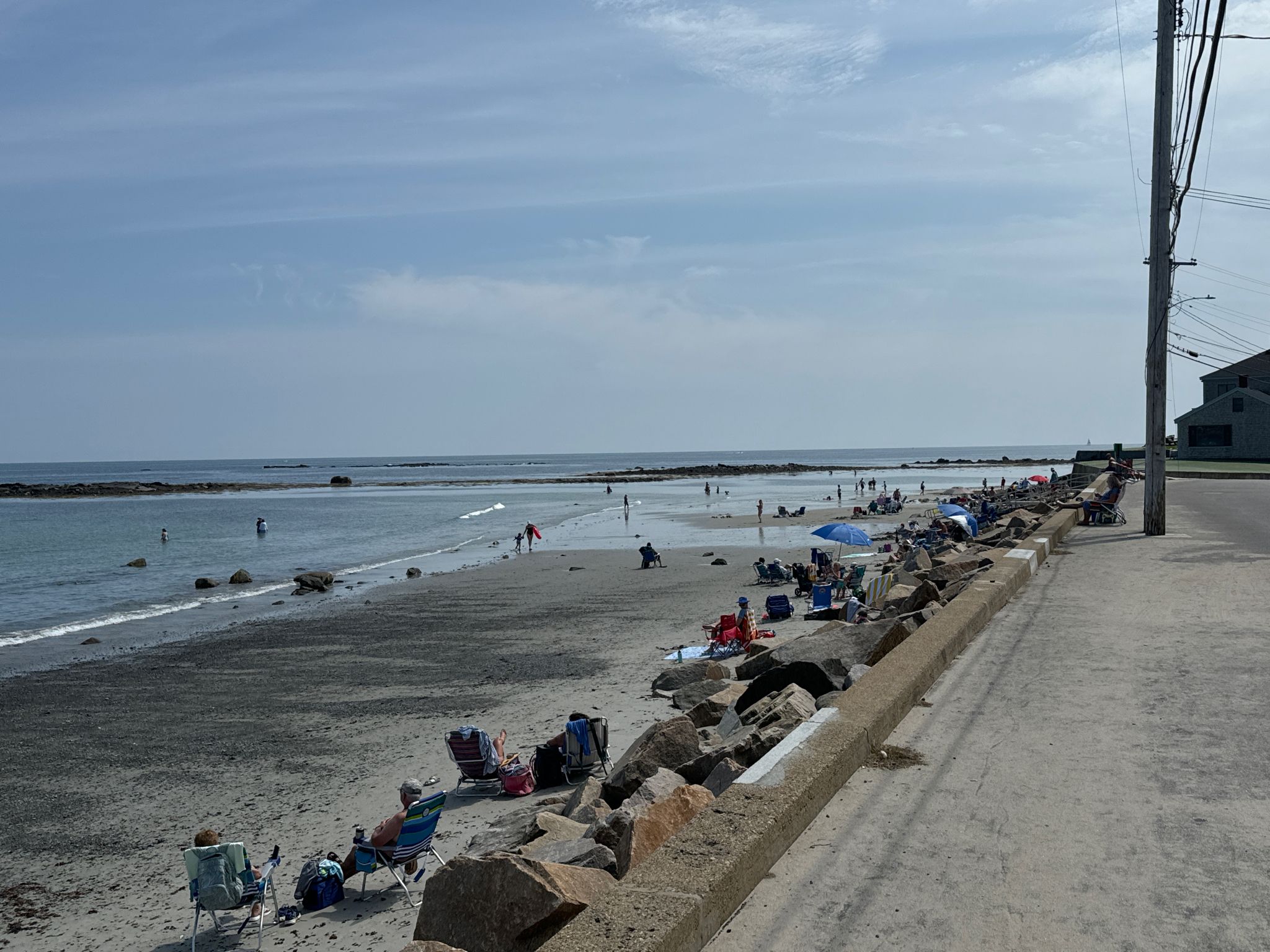 Sunny beach with many people relaxing and wading in the calm ocean. - Webhannet Drive to Post Road loop