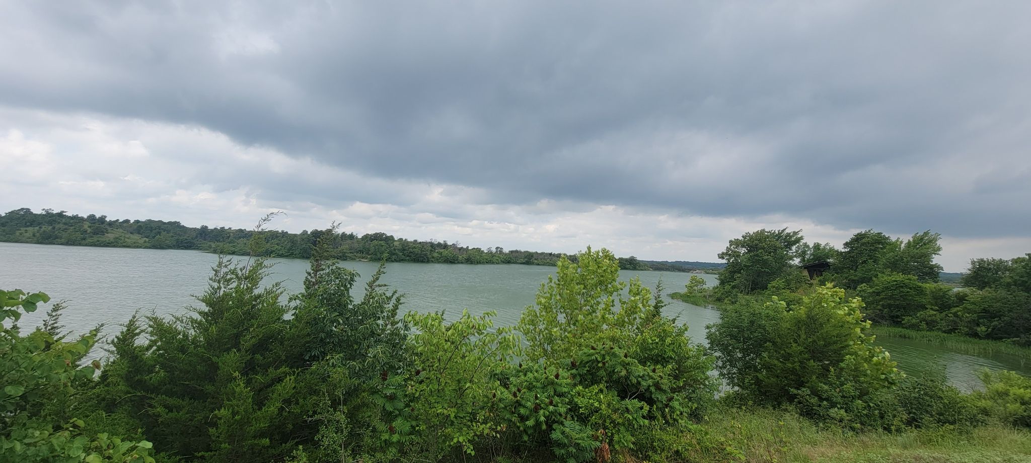 shot of the lake near parking