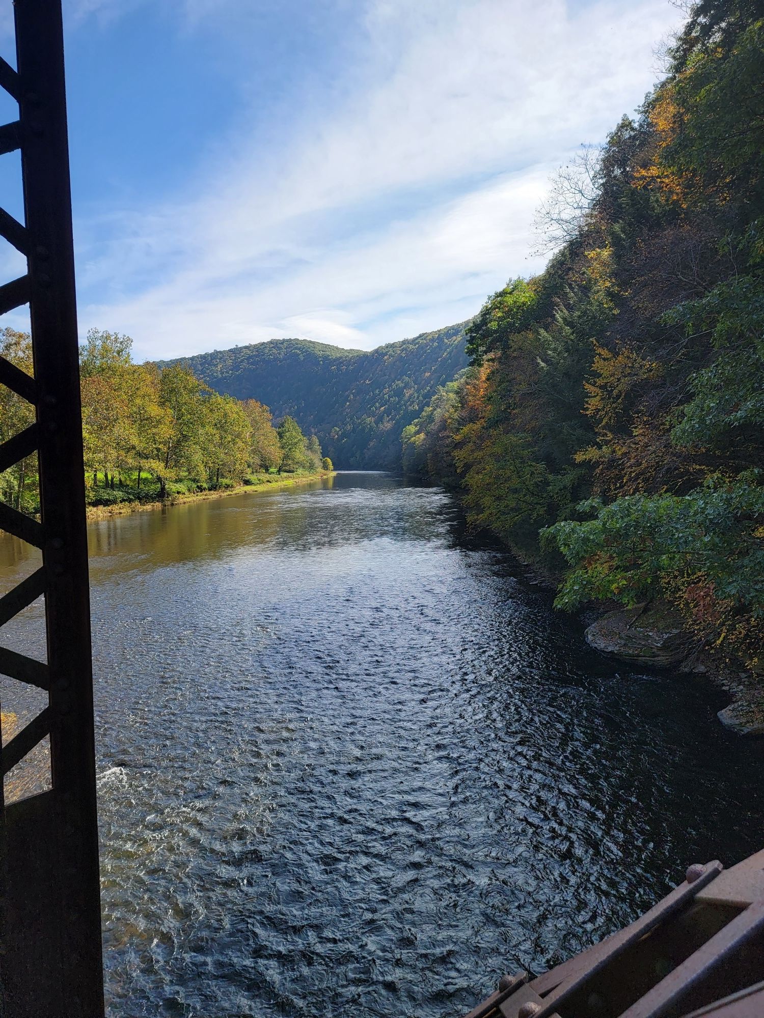River flowing through forested hills, viewed from a bridge on a sunny day. - Hoffman Campground loop from Black Walnut Bottom