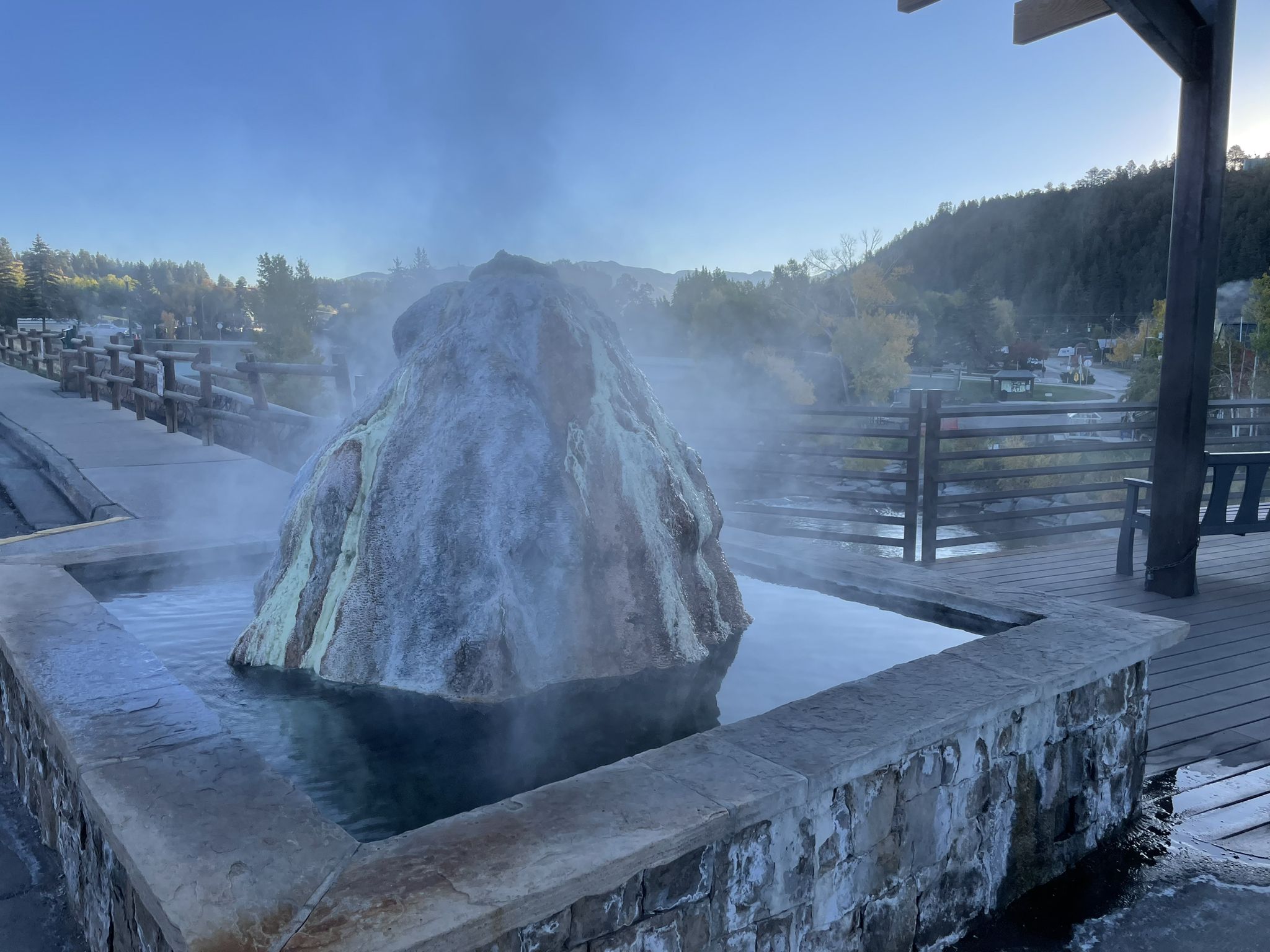 Steaming rock formation in a stone pool under bright morning light. - San Juan Riverwalk Overlook loop from Pagosa Springs