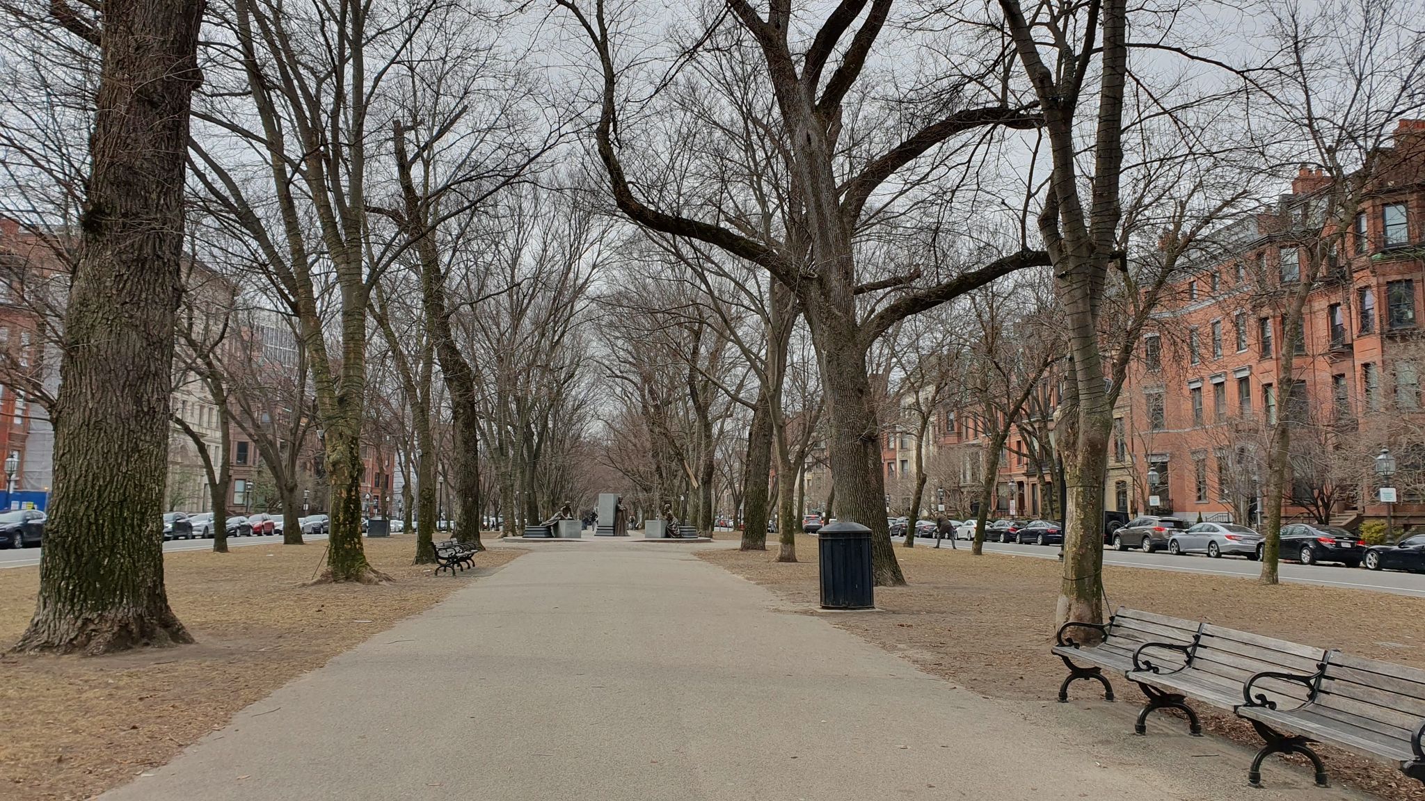 A park path lined with bare trees under an overcast sky. - Commonwealth Avenue — Commonwealth Mall