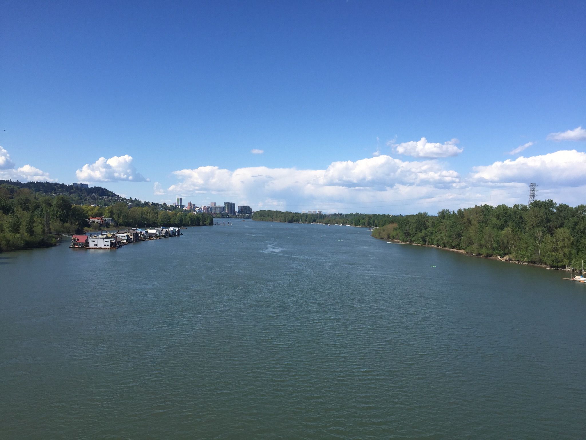 Wide river under a bright blue sky with distant city. - Portland Waterfront and Southwest Hills