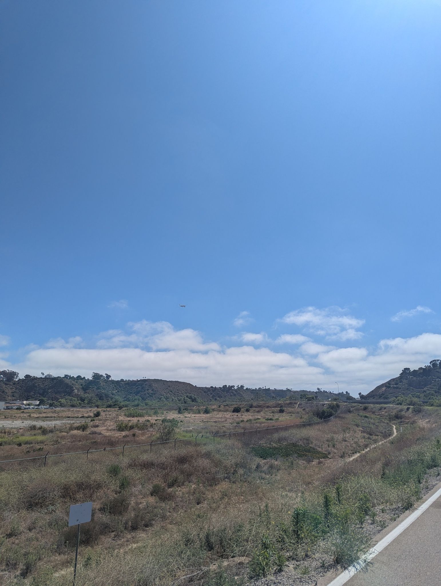 Vast dry landscape with distant hills under a bright, clear blue sky. - San Luis Rey Bike Path – San Luis Rey Bike Path loop from Oceanside Municipal Airport