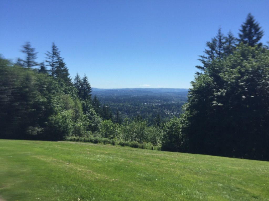 Sunny panoramic view over a green valley and distant hazy landscape. - Leif Erikson Drive – Northwest Leif Erikson Drive loop from Goose Hollow/Southwest Jefferson Street