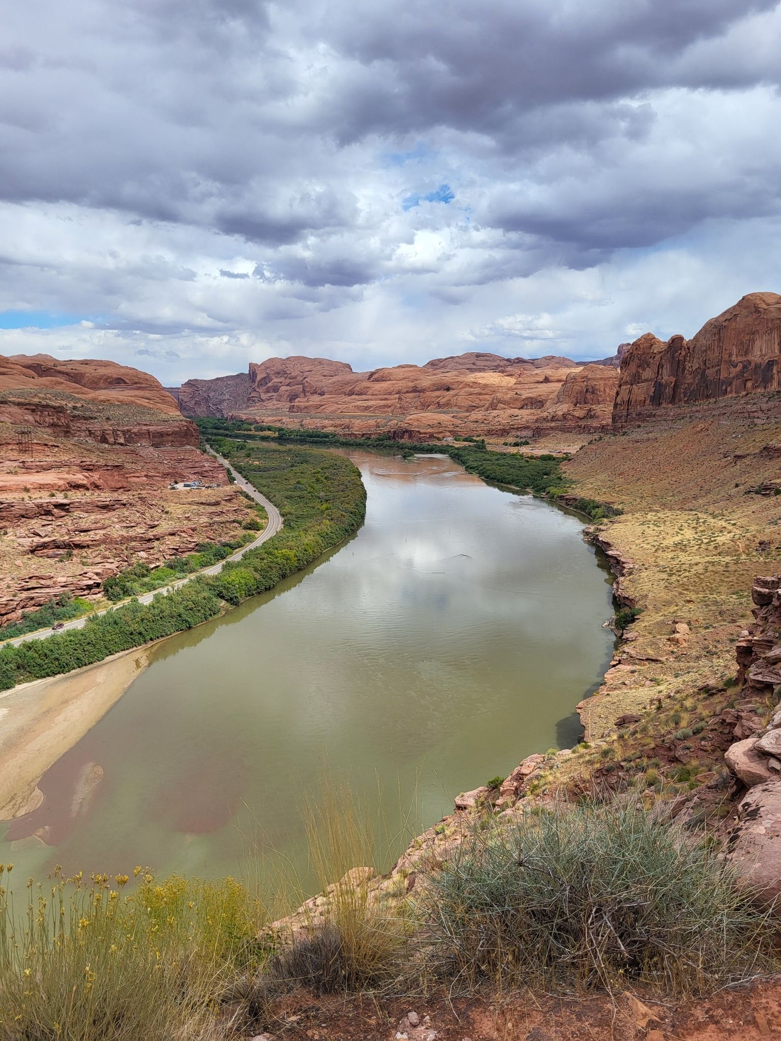 River winding through a deep red rock canyon under cloudy skies. - Captain Ahab (Lower) – HyMasa loop from Amasa Back