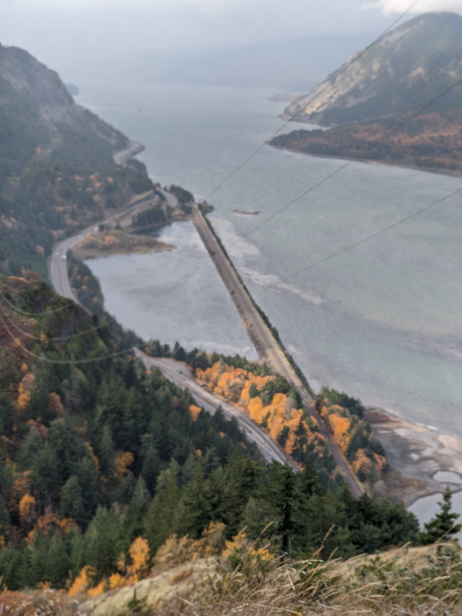 Overhead view of a river, roads, and forested hillsides with vibrant autumn foliage. - Mount Defiance Trail — Columbia River Gorge