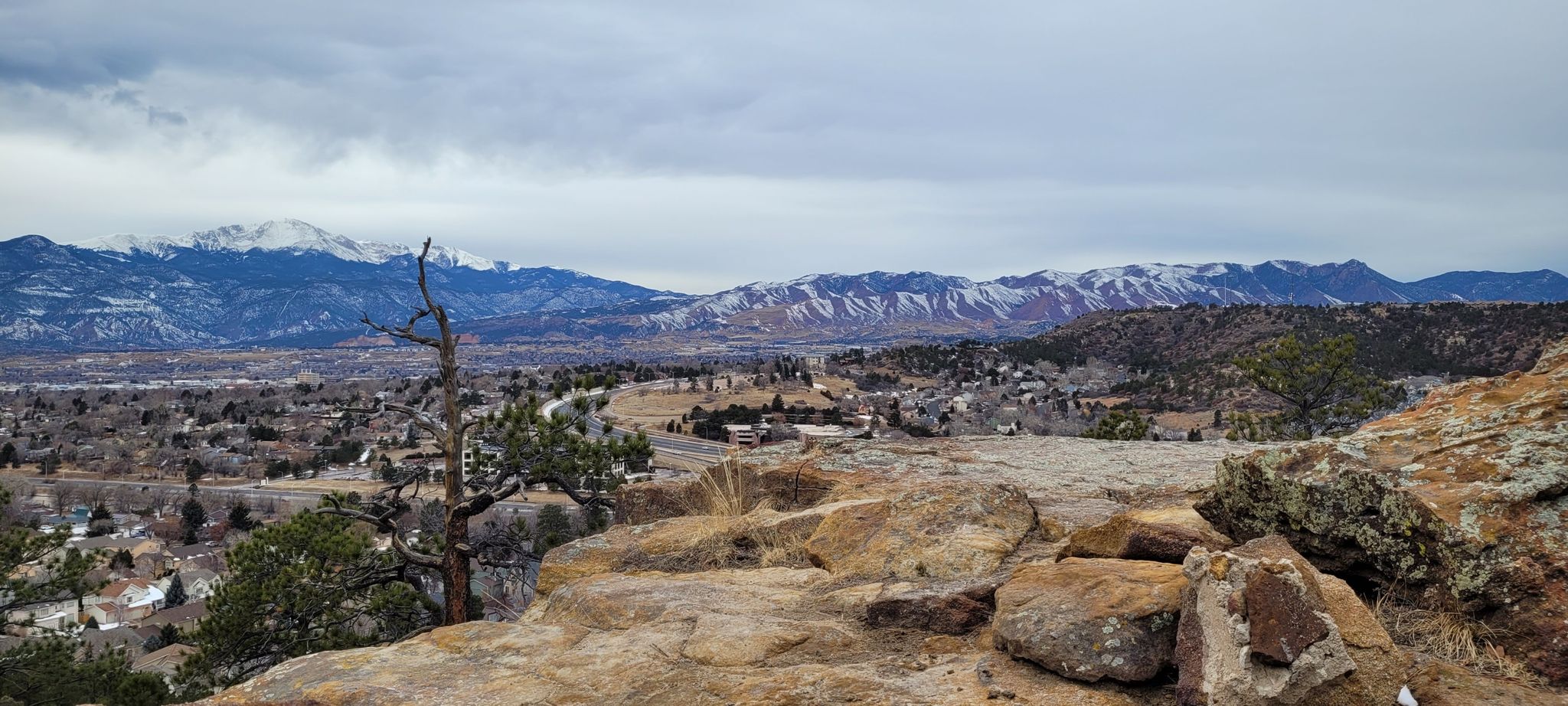Panoramic view of a town and snow-capped mountains under an overcast sky. - Templeton, Mesa and Yucca Trail Loop